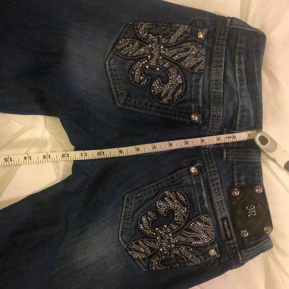 Miss Me boot cut jeans. Professionally altered hem. Size 27 with fleur-de-lis